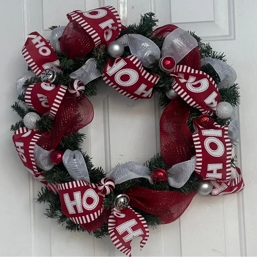 Handmade Christmas wreath, ribbon,bells, and ornaments. Silver, white and red